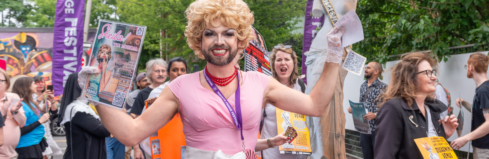 Sheila the drag queen marches in the Fringe artist parade