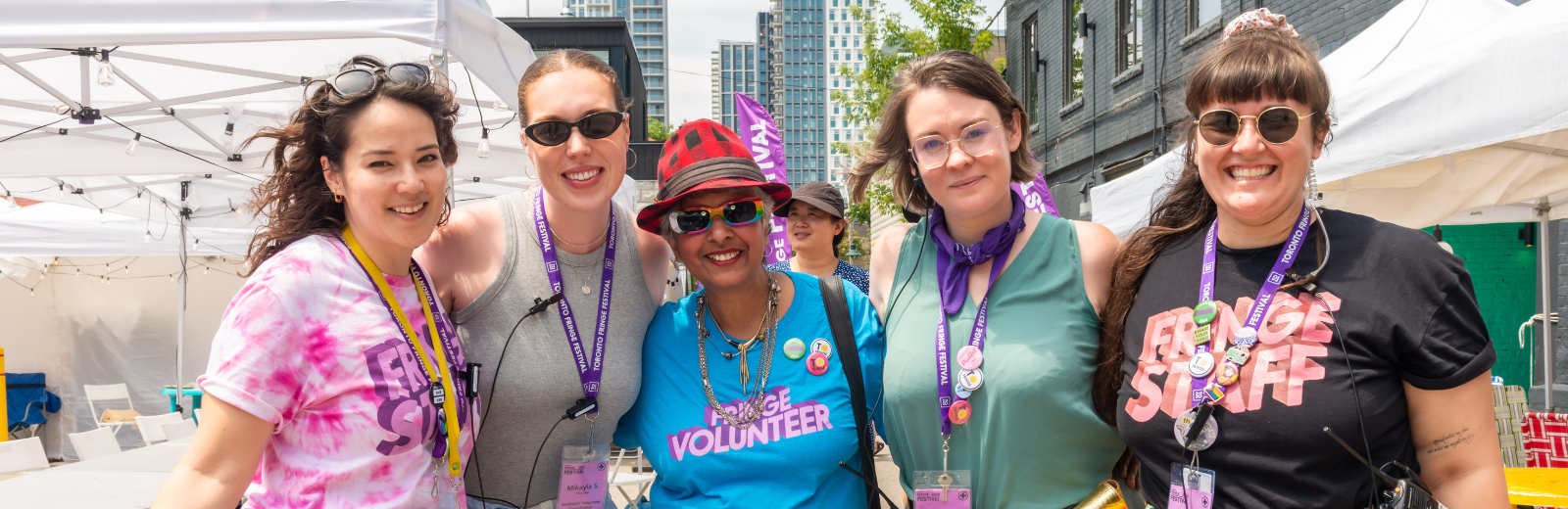 Fringe staff and volunteers smile at the camera