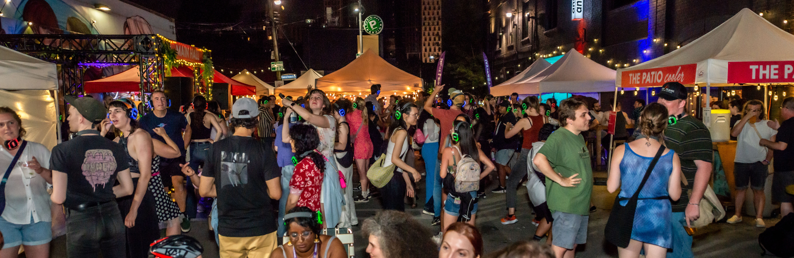 The crowd outside at the Fringe Patio dancing at the Silent Disco